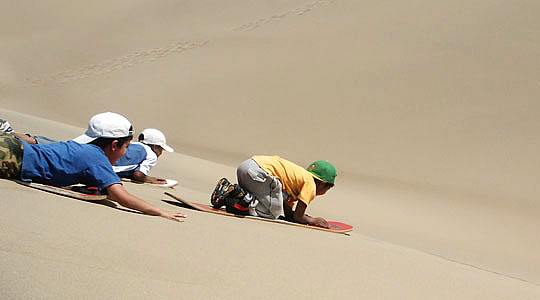 Kids Enjoin Sandboarding