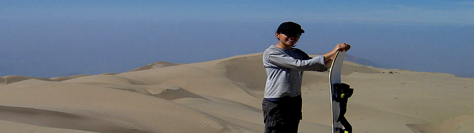 Sandboarder At Cerro Blanco Summit